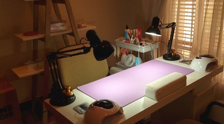 Elegant nail workspace at Nails by Tazmé, Roodepoort, Gauteng, ZA showcasing tools and ambient lighting.