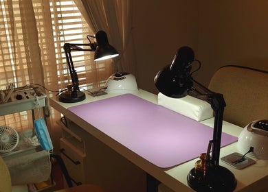 Elegant nail workstation at Nails by Tazmé in Roodepoort, Gauteng, ZA with tools and ambient lighting.