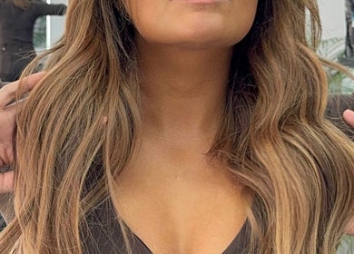 Stylish wavy hair at Erdem Hair London, London, England, GB showcasing expert hairstyling.