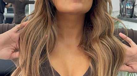 Stylish wavy hair at Erdem Hair London, London, England, GB showcasing expert hairstyling.
