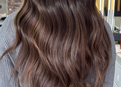 Long, wavy brunette hair styled at Erdem Hair London, London, England, GB.
