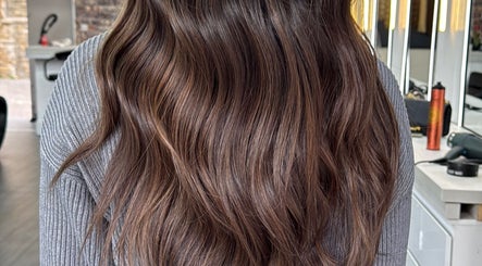 Long, wavy brunette hair styled at Erdem Hair London, London, England, GB.