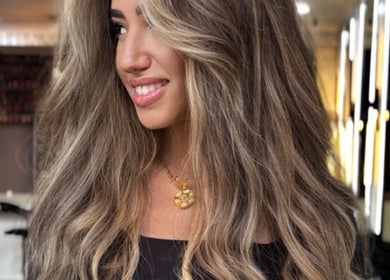 Elegant hair styling at Erdem Hair London, showcasing vibrant waves in London, England, GB.