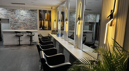 Erdem Hair London salon with sleek chairs and modern mirrors in London, England, GB.