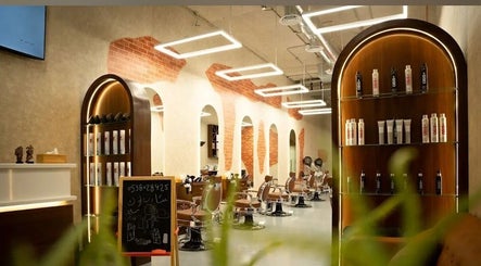 Luxurious salon interior at Sharp Look in Riyadh, Riyadh Province, SA, featuring elegant chairs and product displays.