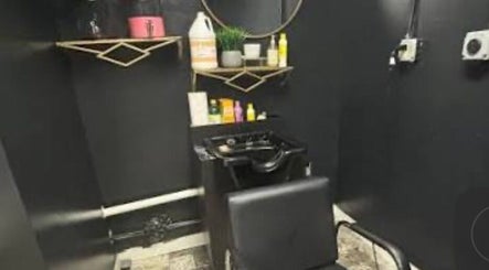 Glamour and Glitter by Jessica salon wash station with sleek black decor in Greenwood, South Carolina, US.