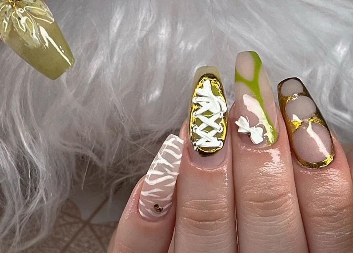 Detailed nail art with lace and bows at ClawzbyLau, Canelones, Departamento De Canelones, UY.