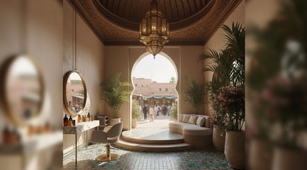 Fitrah Men Center in Marrakech showcases luxurious decor with an open archway and lush plants.