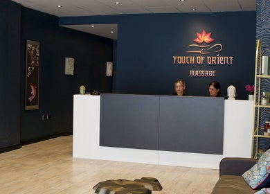 Reception area of Touch of Orient in Reading, England, GB with modern decor and welcoming staff.