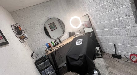 Modern barber chair setup at Donzos_cuts, Pembroke, Wales, GB showcasing professional styling tools.