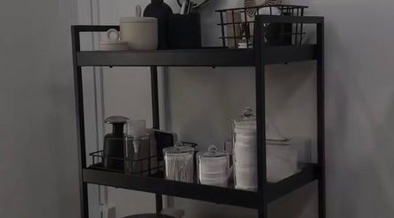 Beauty essentials neatly arranged on a shelf at Ré-luxe Beauty, Mitcham, England, GB.