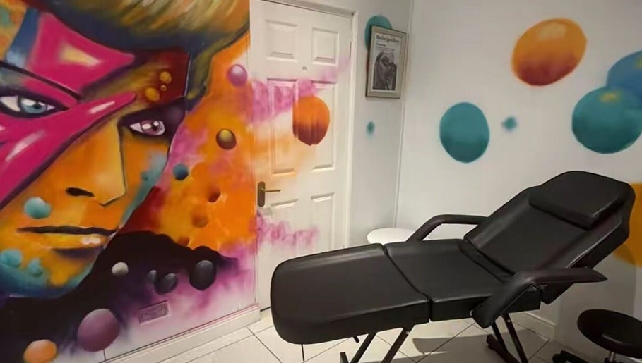 Vibrant mural and relaxing chair in Lunar Lines, Newhaven, England, GB.