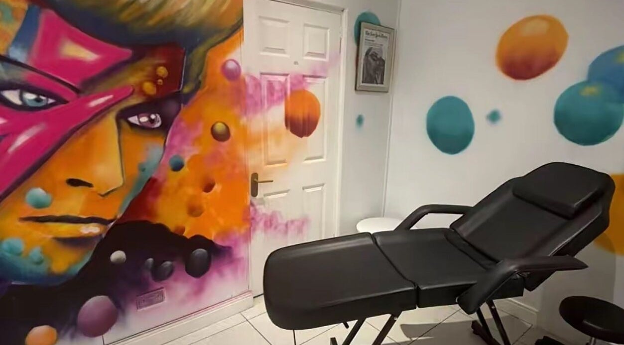 Vibrant mural and relaxing chair in Lunar Lines, Newhaven, England, GB.