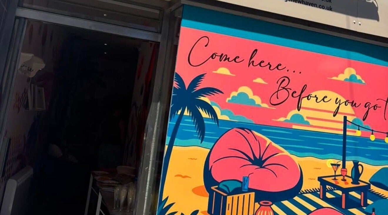 Colorful tropical mural at Lunar Lines, Newhaven, England, GB with palm trees and beach sunset.