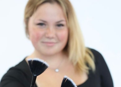 Makeup artist at BB Esthetics in Lyman, South Carolina, US, showcasing a makeup brush.