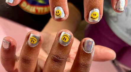 Silver nails with smiley face accents at Studio Kay at Gloss and Glow, Il-Mosta, MT.