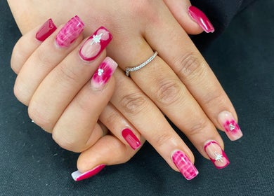 Elegant pink floral nail art at Arch Design Beauty, Tamworth, England, GB.