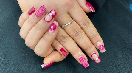 Elegant pink floral nail art at Arch Design Beauty, Tamworth, England, GB.