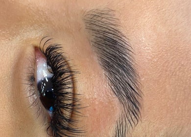 Close-up of lush eyelashes and well-groomed brow at Arch Design Beauty in Tamworth, England, GB.