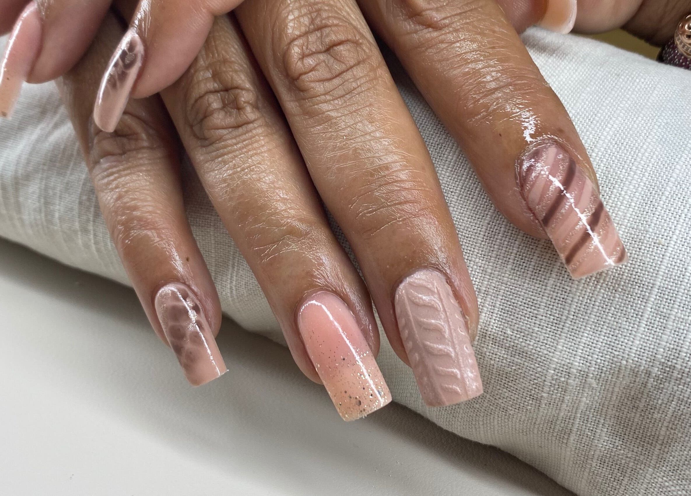 Intricately designed nails at Arch Design Beauty, Tamworth, England, GB showcasing elegant nail art.