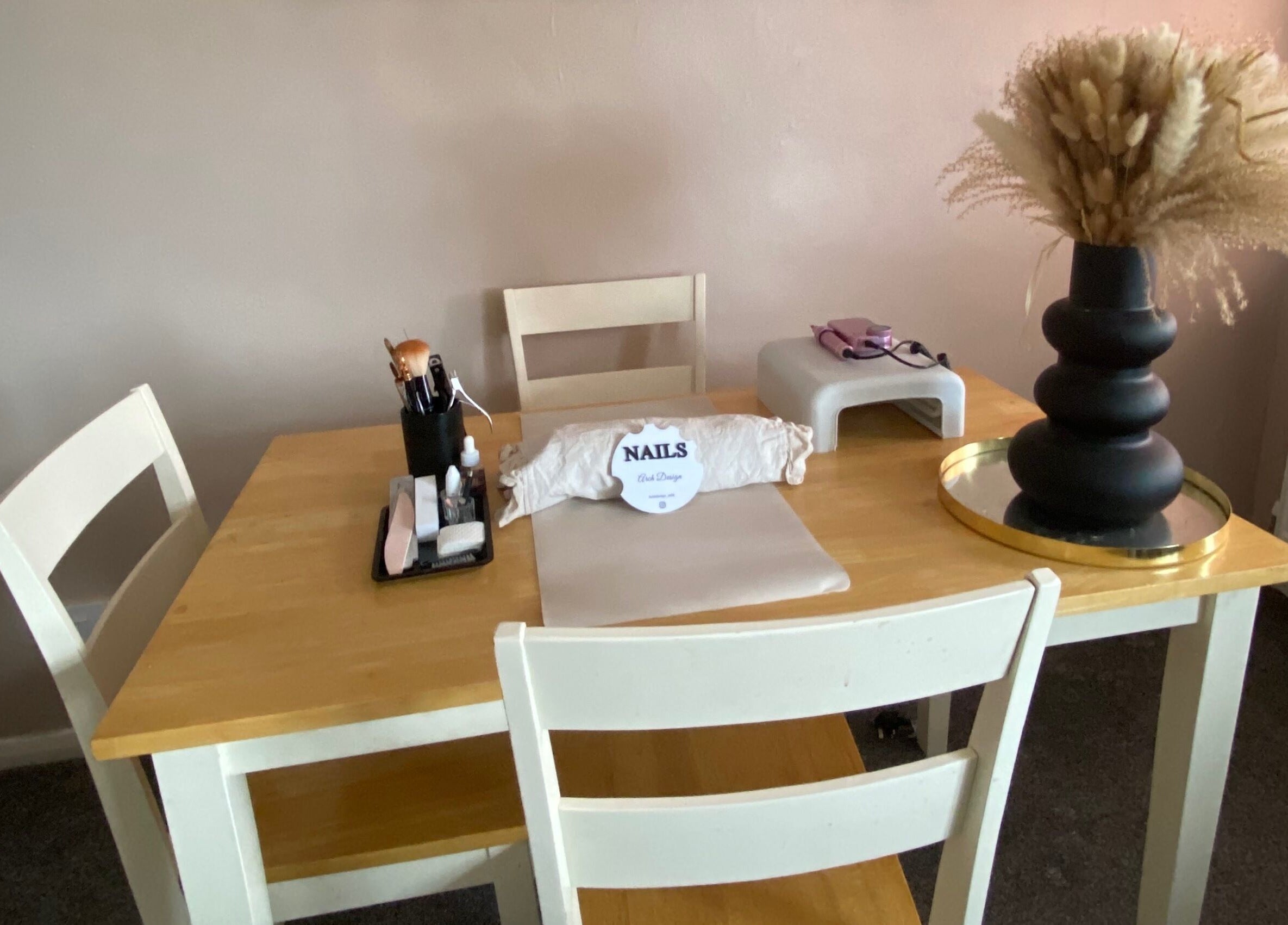 Nail table setup at Arch Design Beauty, Tamworth, England, GB, showcasing tools and decor.