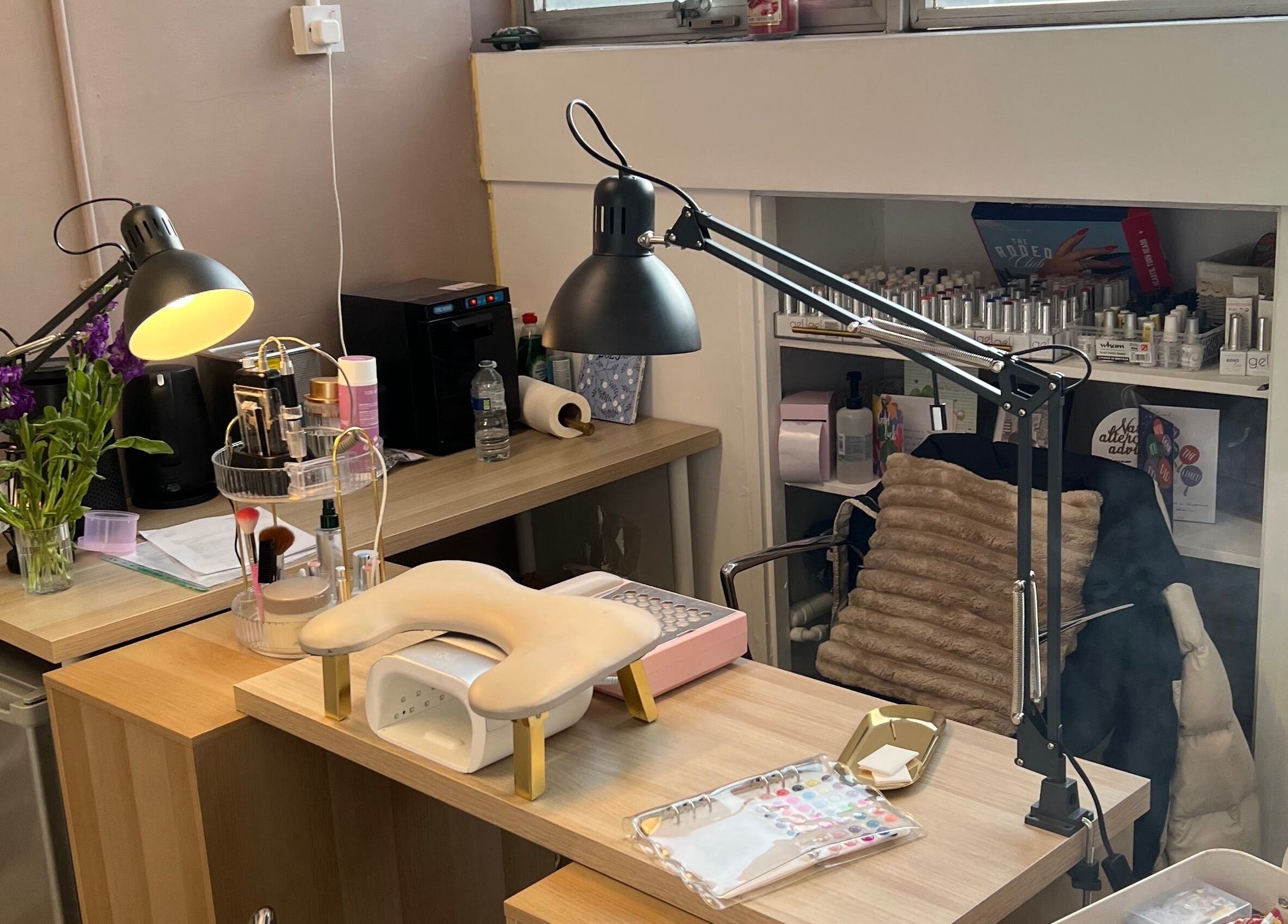 Chic manicure station at The wee Nail Room, Perth, Scotland, GB with tools, lamps, and decor.