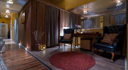 Cozy relaxation area at The ZenSai Spa, Burbank, California, US with plush seating and warm lighting.