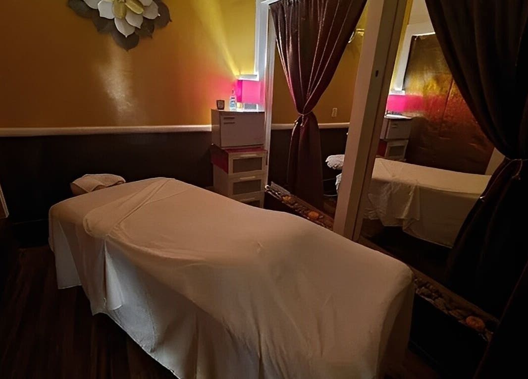 Cozy massage room with warm lighting at The ZenSai Spa in Burbank, California, US.