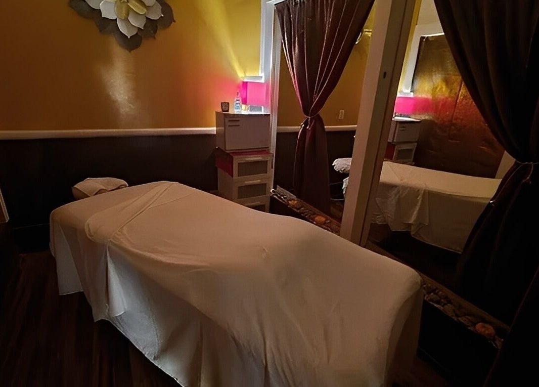 Cozy massage room with warm lighting at The ZenSai Spa in Burbank, California, US.