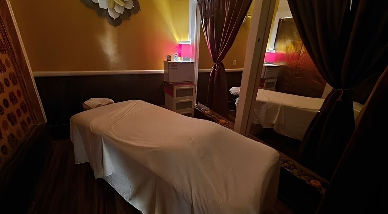 Cozy massage room with warm lighting at The ZenSai Spa in Burbank, California, US.