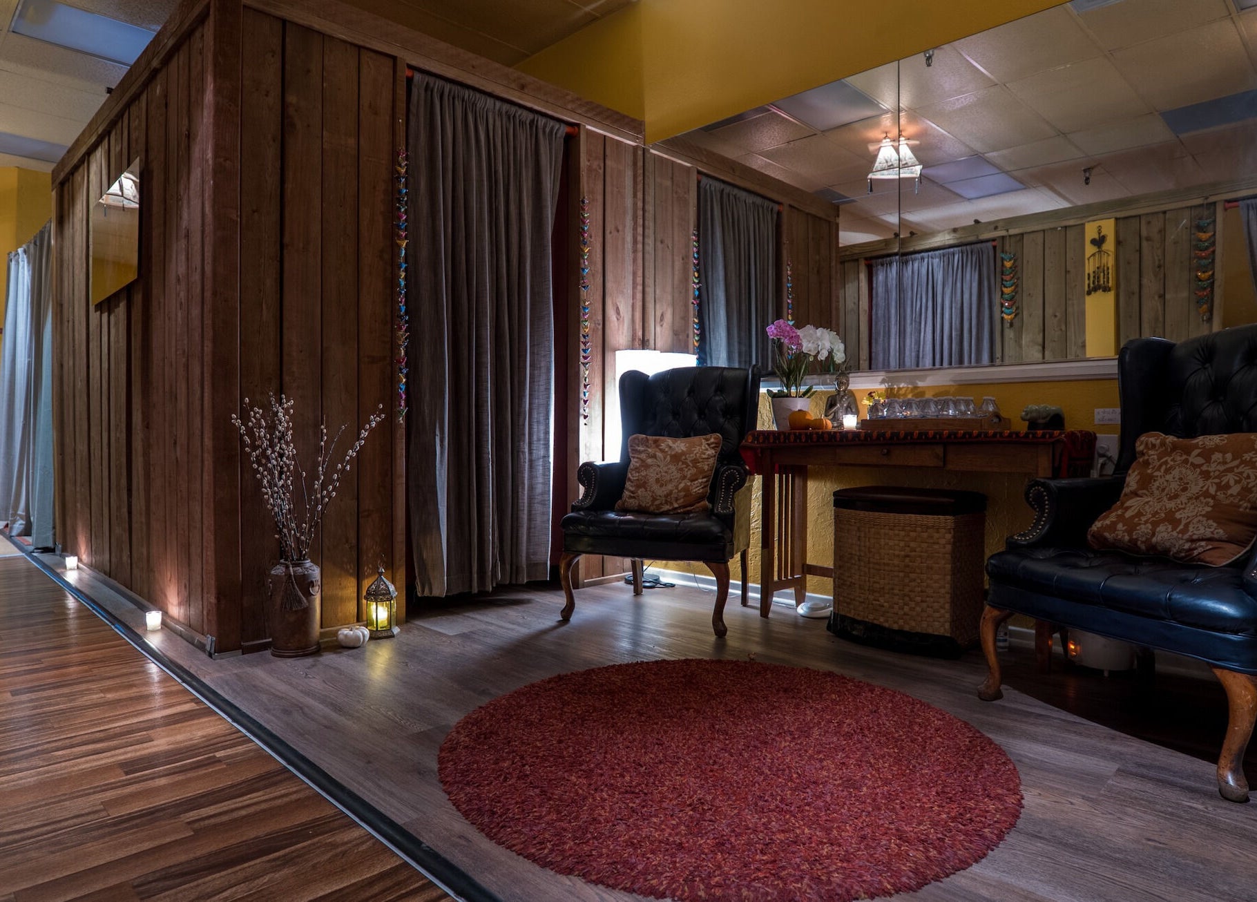 Relaxing lounge area at The ZenSai Spa in Burbank, California, US, featuring comfortable chairs and warm lighting.