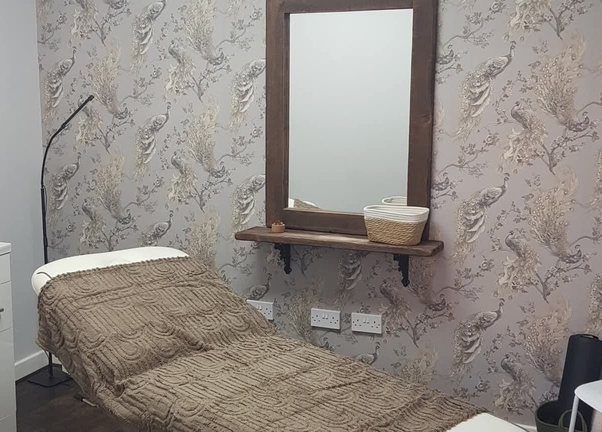 Relaxing therapy room at Peak Performance Soft Tissue Therapy, Kirriemuir, Scotland, GB, featuring peacock decor.