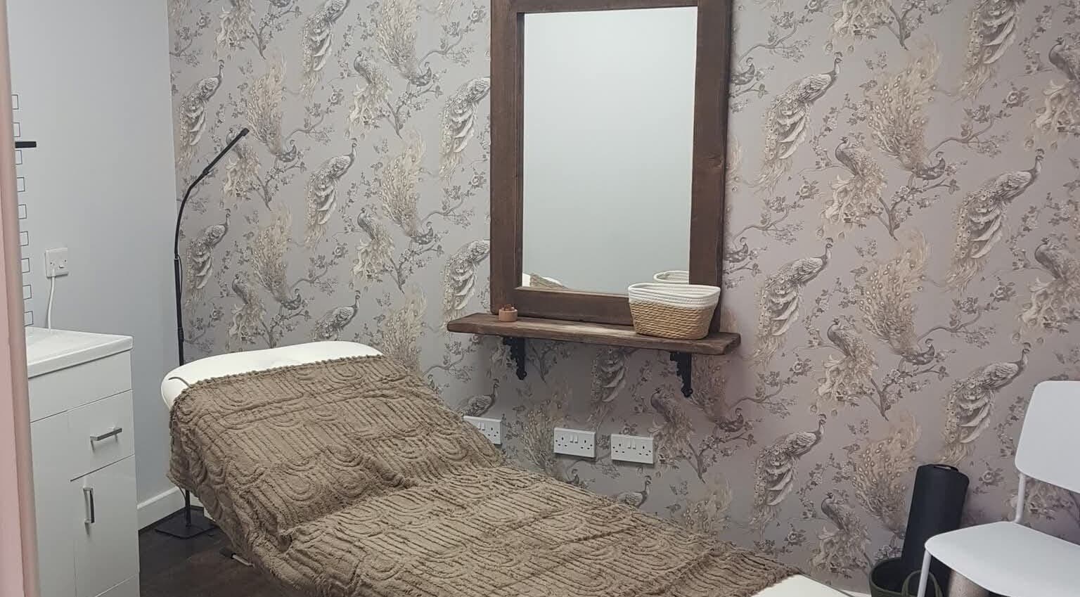 Relaxing therapy room at Peak Performance Soft Tissue Therapy, Kirriemuir, Scotland, GB, featuring peacock decor.