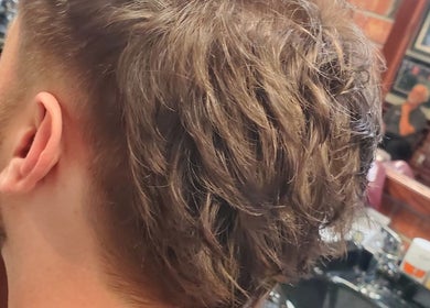 Close-up of a stylish men's haircut at Men's Grooming Lounge By Mel, Mission Viejo, California, US.