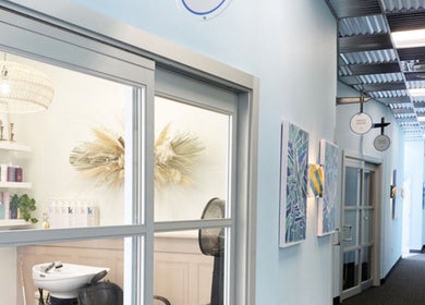 Entrance of Men's Grooming Lounge By Mel in Mission Viejo, California, highlighting its modern interior design.