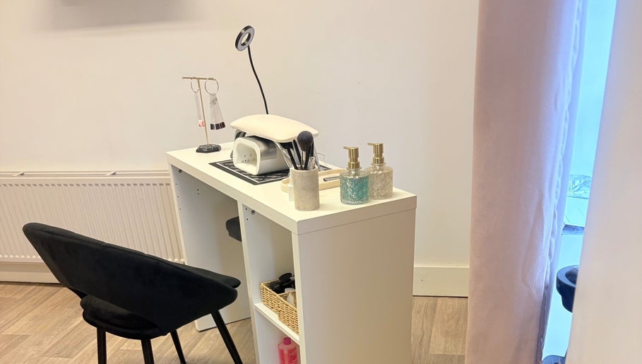 Manicure station at Skye Beauty, Ashford, England, GB with tools and products on a white desk.