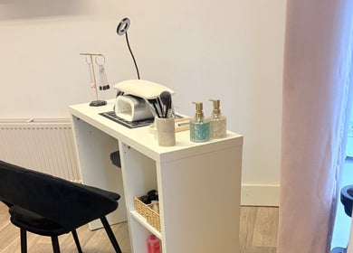 Manicure station at Skye Beauty, Ashford, England, GB with tools and products on a white desk.
