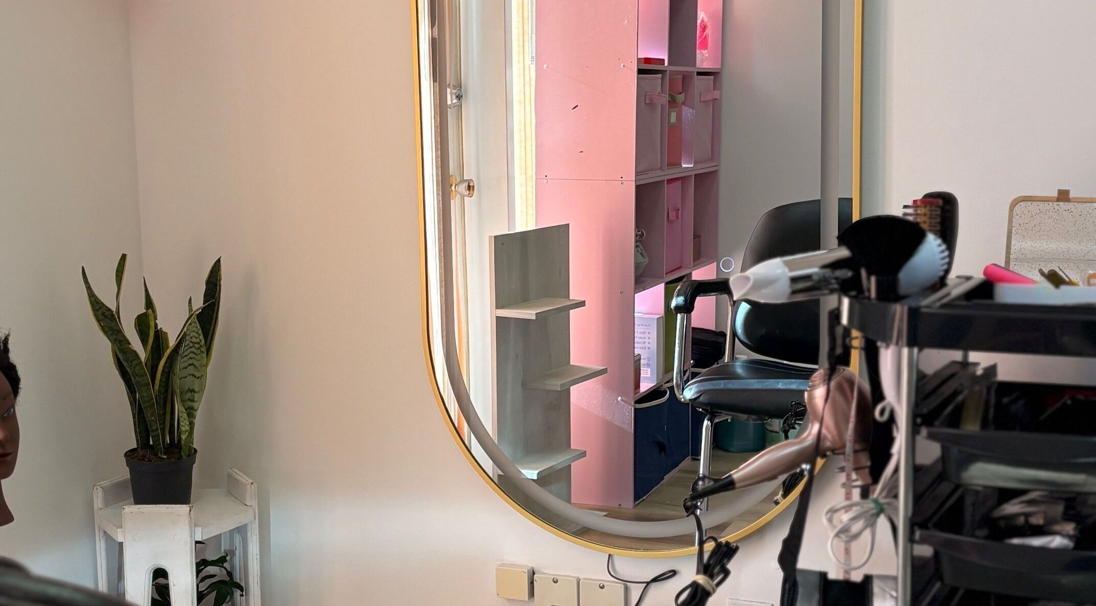 Modern styling station at FADIV salon de coiffure, Laval, Québec, CA with mirror and tools.