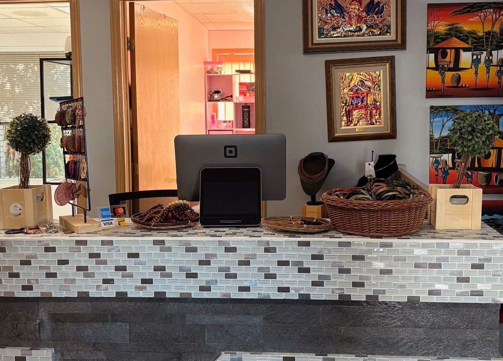 Reception area with art at FADIV salon de coiffure, Laval, Québec, CA.