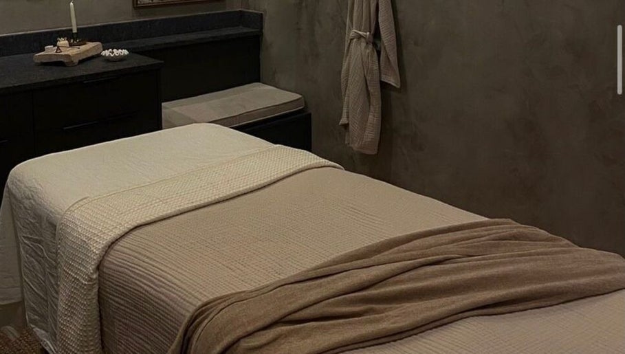 Calm spa room at STUDIO LEME DUBAI, Dubai, Dubai, AE, featuring a massage table with beige linens.