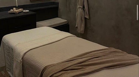 Calm spa room at STUDIO LEME DUBAI, Dubai, Dubai, AE, featuring a massage table with beige linens.