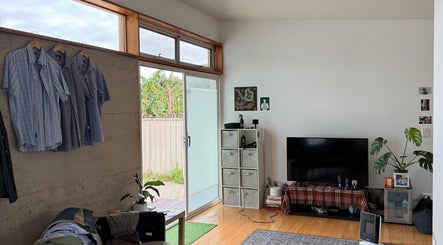 Cozy lounge space at cutsbyhudson, O'connor, Western Australia, with natural light and stylish decor.