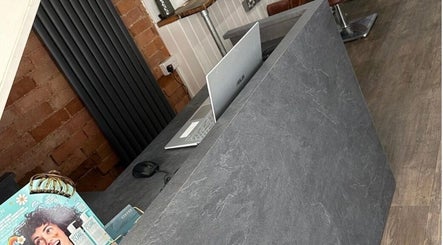 Reception desk at Styled by Beth, Bromsgrove, England, GB featuring modern laptop and stylish decor.