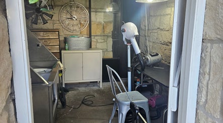 Interior of Killara Pups grooming area with rustic stone walls in Killara, New South Wales, AU.