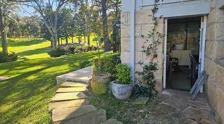 Stone path and lush garden at Killara Pups, Killara, New South Wales, AU