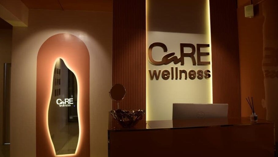 Care Wellness Bangalore lobby with warm lighting in Bengaluru, Karnataka, IN. Elegant design illuminates welcome space.