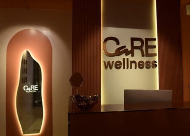 Care Wellness Bangalore lobby with warm lighting in Bengaluru, Karnataka, IN. Elegant design illuminates welcome space.