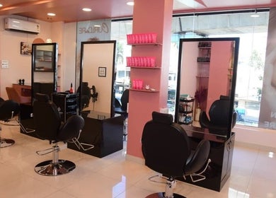 Elegant salon chairs and mirrors at Care Wellness Bangalore, Bengaluru, Karnataka, IN.