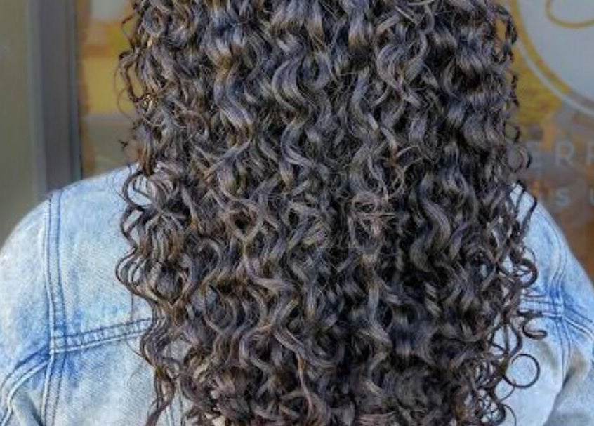 Stylish curly hairstyle showcased at Care Wellness Bangalore in Bengaluru, Karnataka, IN.