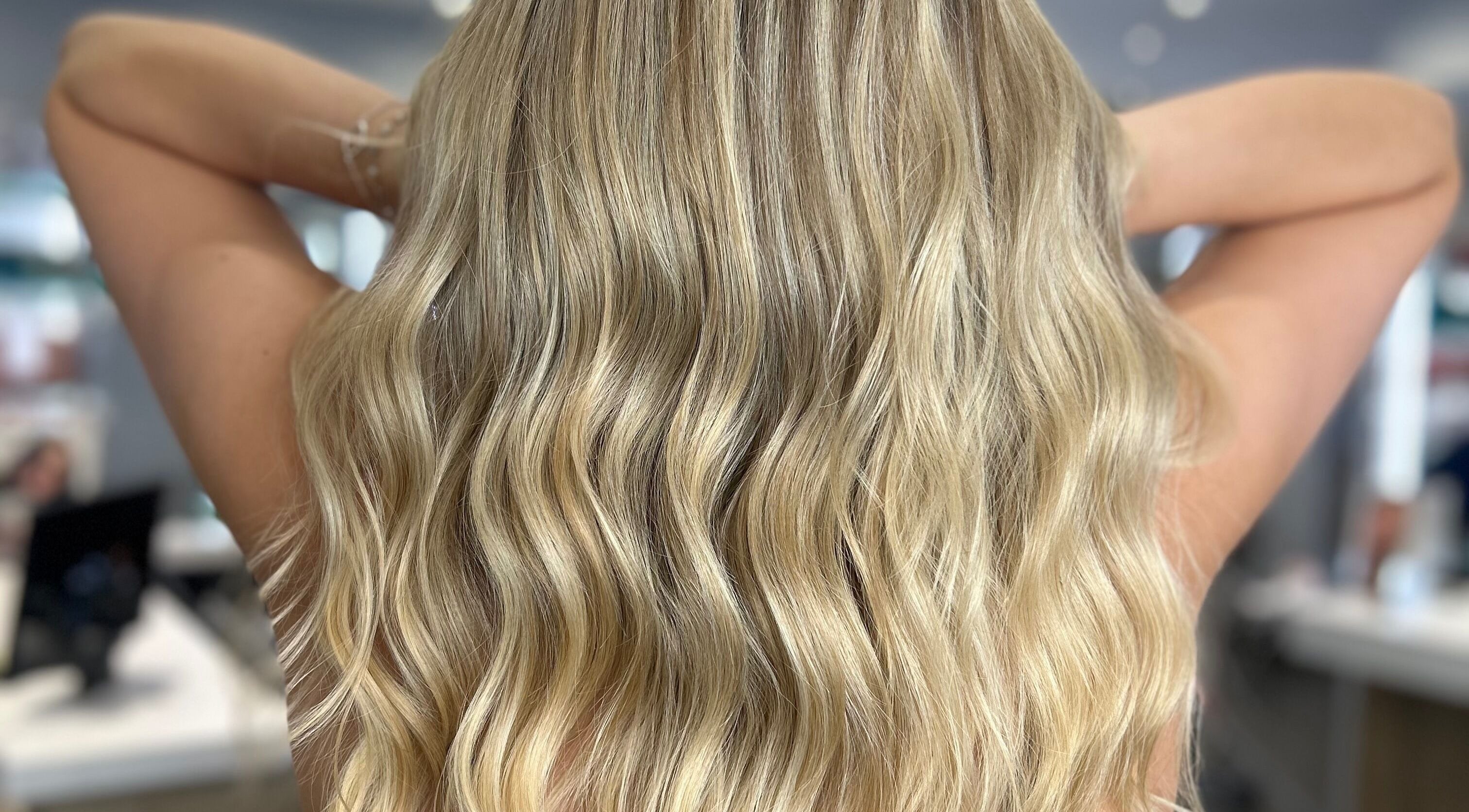 Blonde wavy hair styled at hairbyelliemay in Royal Tunbridge Wells, England, GB salon.